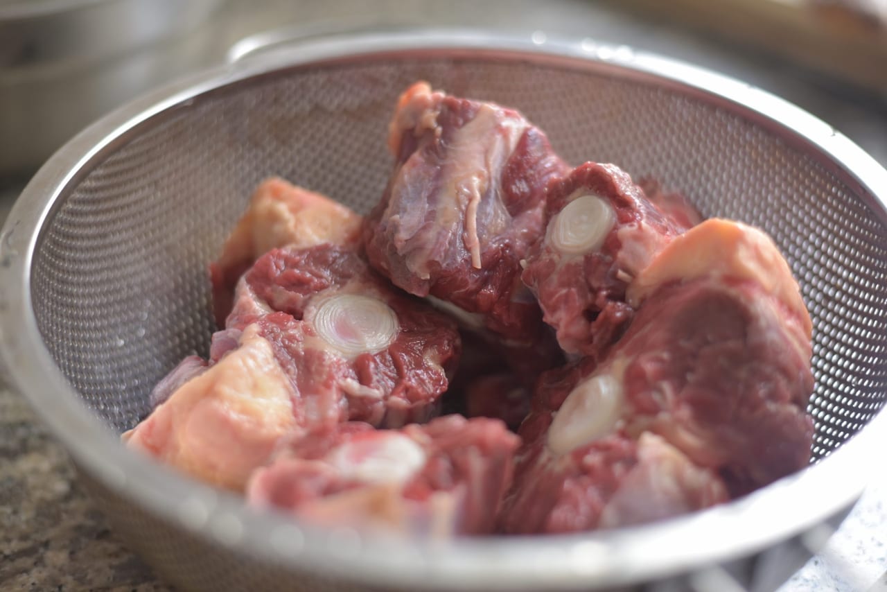 oxtail and green almonds stew