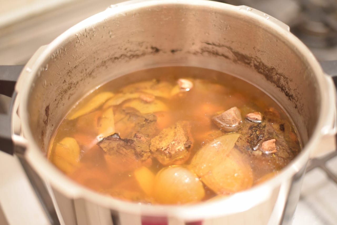 oxtail and green almonds stew
